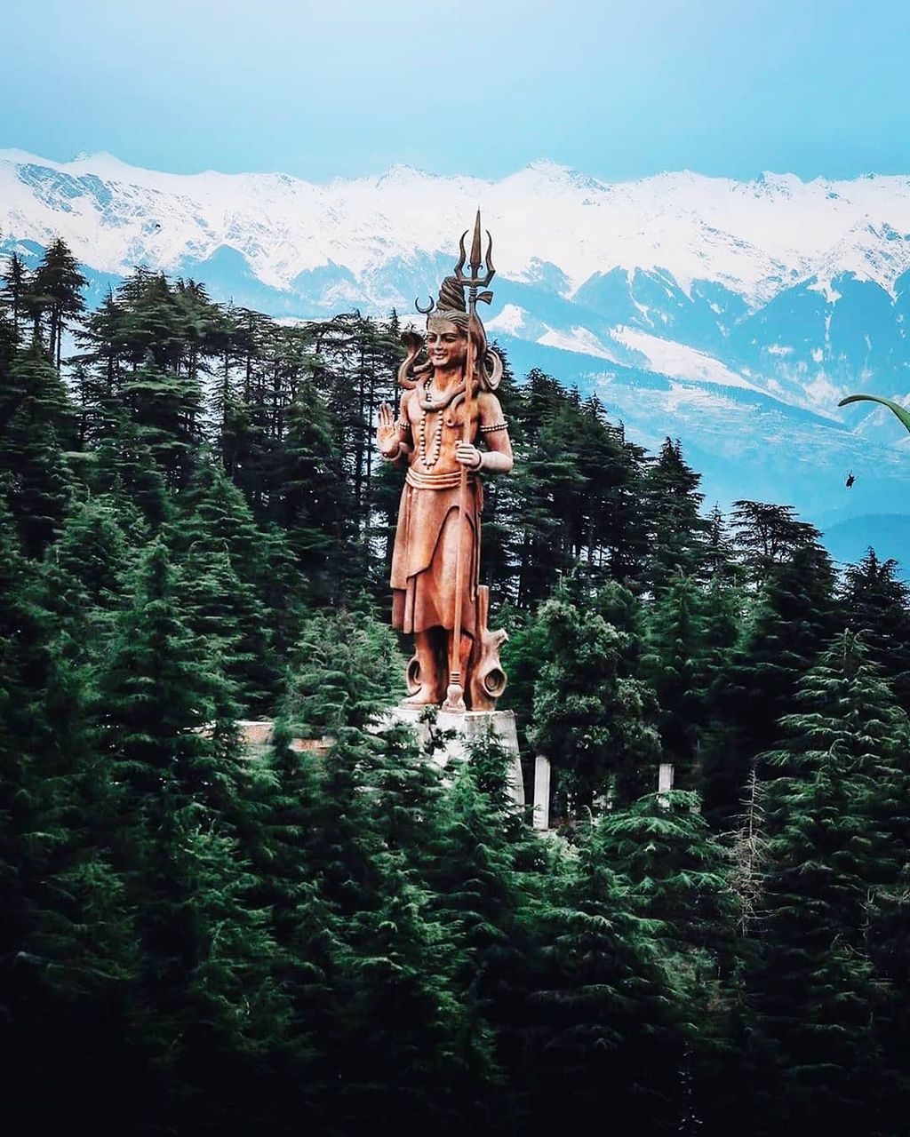 mountain, tree, nature, plant, sculpture, sky, human representation, art and craft, representation, no people, day, statue, creativity, beauty in nature, religion, spirituality, architecture, male likeness, tranquil scene, environment, outdoors