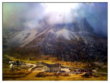 Scenic view of landscape against cloudy sky