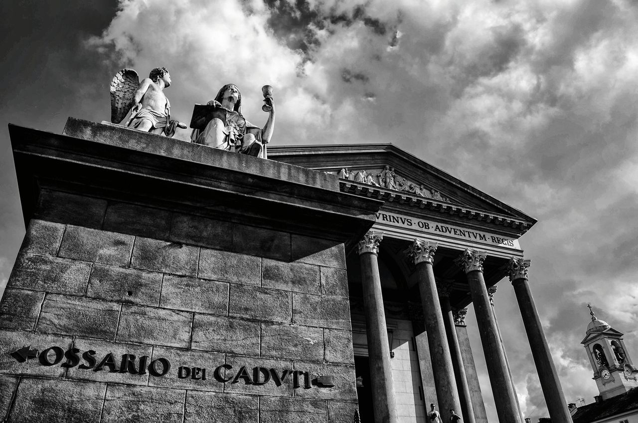 architecture, cloud - sky, low angle view, sky, built structure, building exterior, architectural column, outdoors, history, travel destinations, sculpture, day, statue, no people