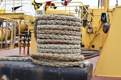 Close-up of rope rolled on ship