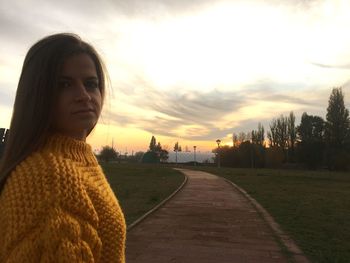 Portrait of woman looking at sunset