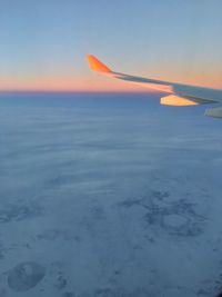 Scenic view of snow against sky during sunset