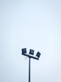 Low angle view of street light against clear sky