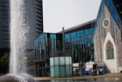 Close-up of water against buildings