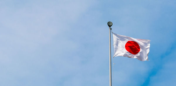 Low angle view of flag against sky