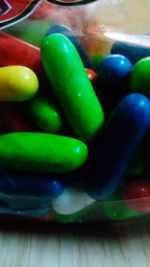 Close-up of multi colored candies on table