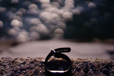 Close-up of pebbles on beach against sky