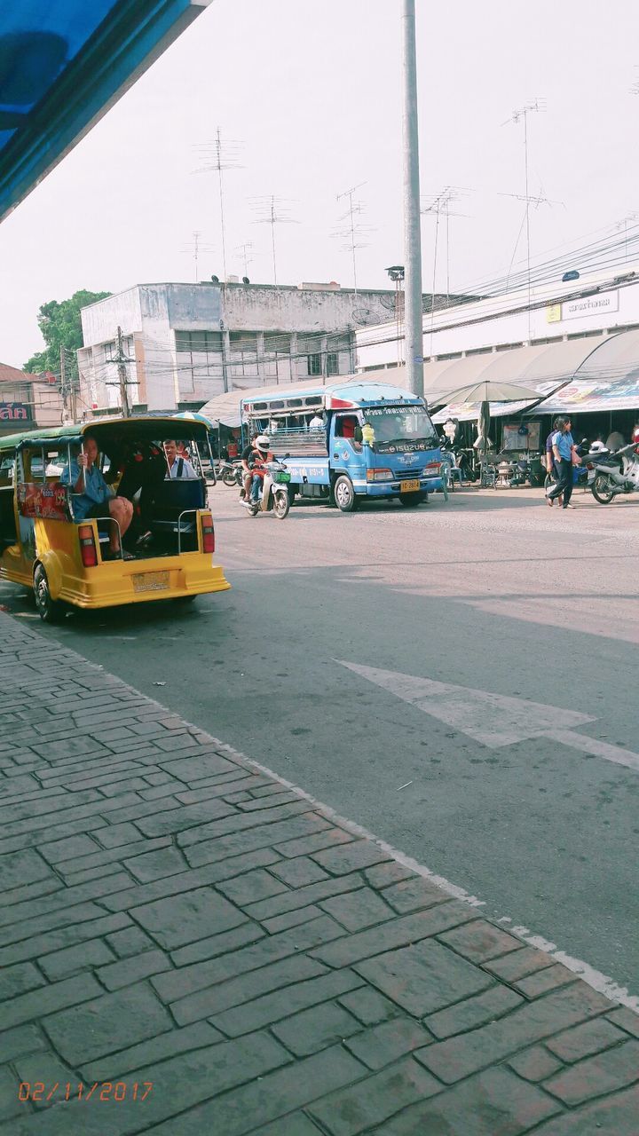 CARS ON STREET IN CITY