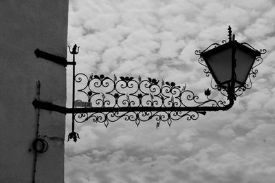 Low angle view of street light against sky