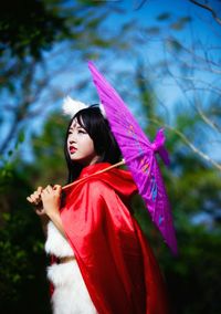 Close-up of woman standing in forest