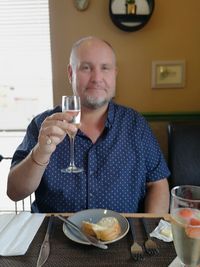 Portrait of a man drinking glasses