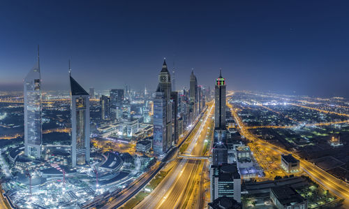 Aerial view of illuminated dubai buildings at night