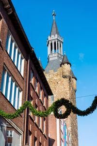 Low angle view of bell tower against sky