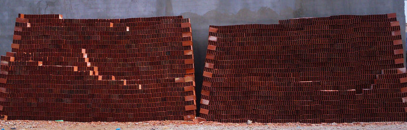 Close-up of brick wall against sky