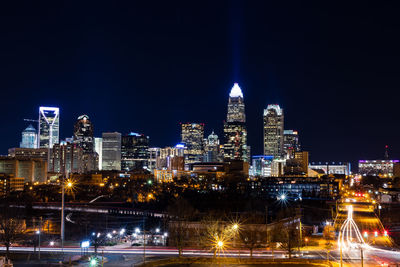 Illuminated buildings in city at night