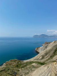 Scenic view of sea against blue sky