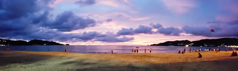 Panoramic view of beach against sky during sunset