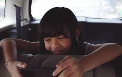 Portrait of boy sitting in car