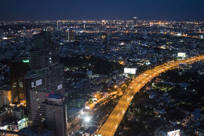 High angle view of illuminated cityscape at night