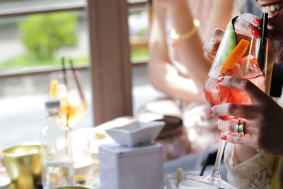 Close-up of hand holding wine glass