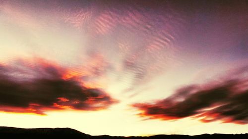 Scenic view of dramatic sky during sunset