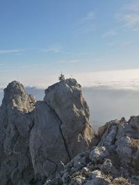 Rock formations on landscape against sky