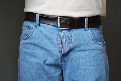 Rear view of man wearing blue jeans