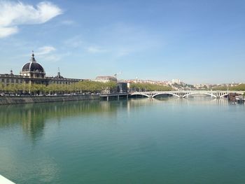 View of built structure with river in foreground