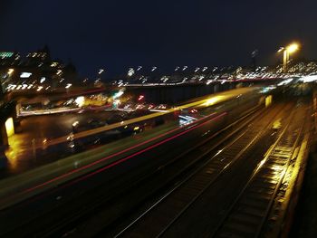High angle view of light trails in city at night