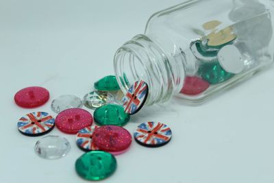 High angle view of candies in glass jar on table