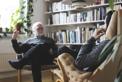 Therapist explaining male patient during session at home office