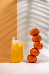 Close-up of orange juice on table