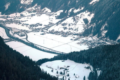 High angle view of people skiing on snowcapped mountain