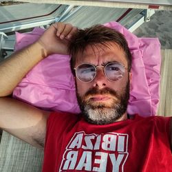 Portrait of man lying on floor