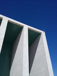 Low angle view of built structure against blue sky