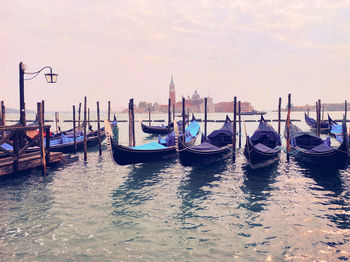 Boats moored in canal