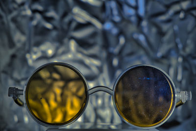 Close-up of eyeglasses on glass