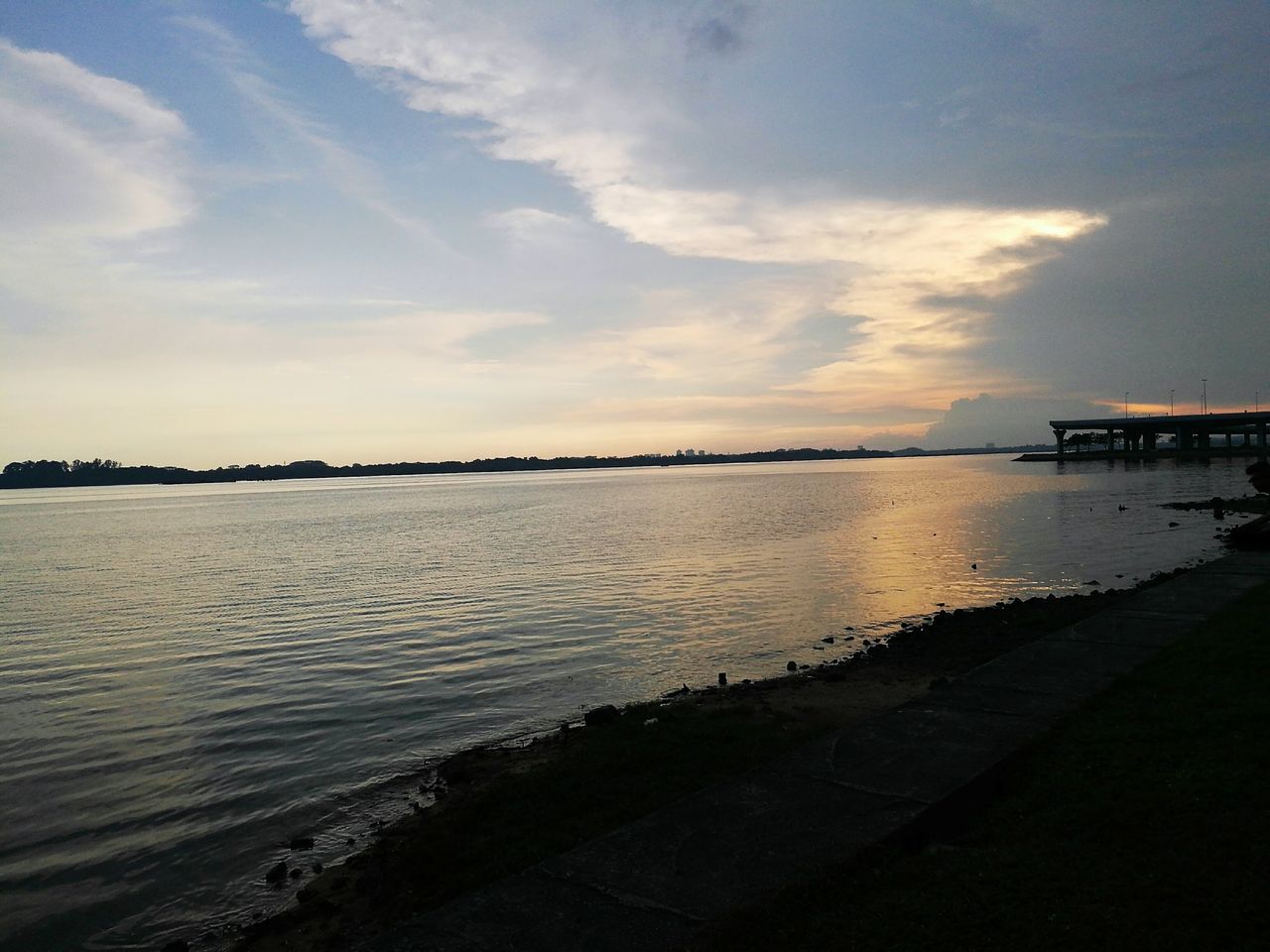 water, sky, tranquil scene, sunset, scenics, tranquility, sea, rippled, cloud - sky, travel destinations, calm, cloud, tourism, nature, beauty in nature, vacations, ocean, footpath, distant, seascape, non-urban scene, no people