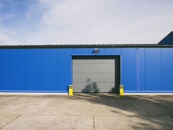 Closed warehouse against sky