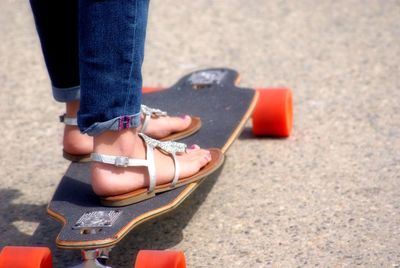 Low section of woman wearing high heels