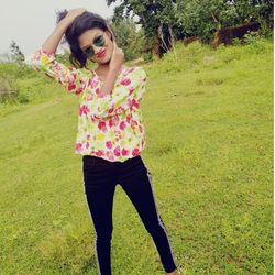 Beautiful woman standing on field