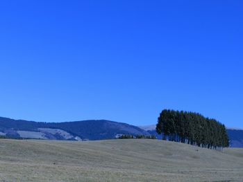 Scenic view of mountains against clear blue sky