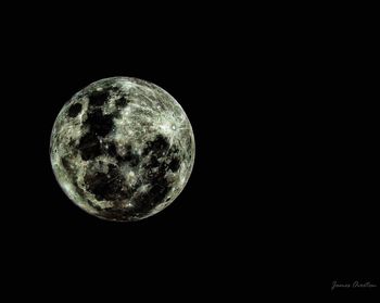 Low angle view of moon against sky at night