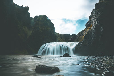 View of waterfall against the sky