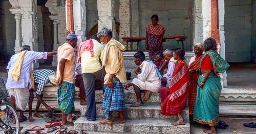 People on sidewalk in city