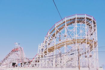 AMUSEMENT PARK RIDE AGAINST BLUE SKY