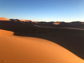 Scenic view of desert against clear sky