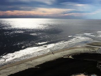 Scenic view of sea against cloudy sky