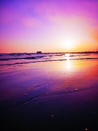 Scenic view of beach against sky during sunset