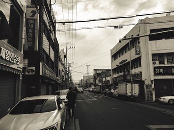 Street in city against sky